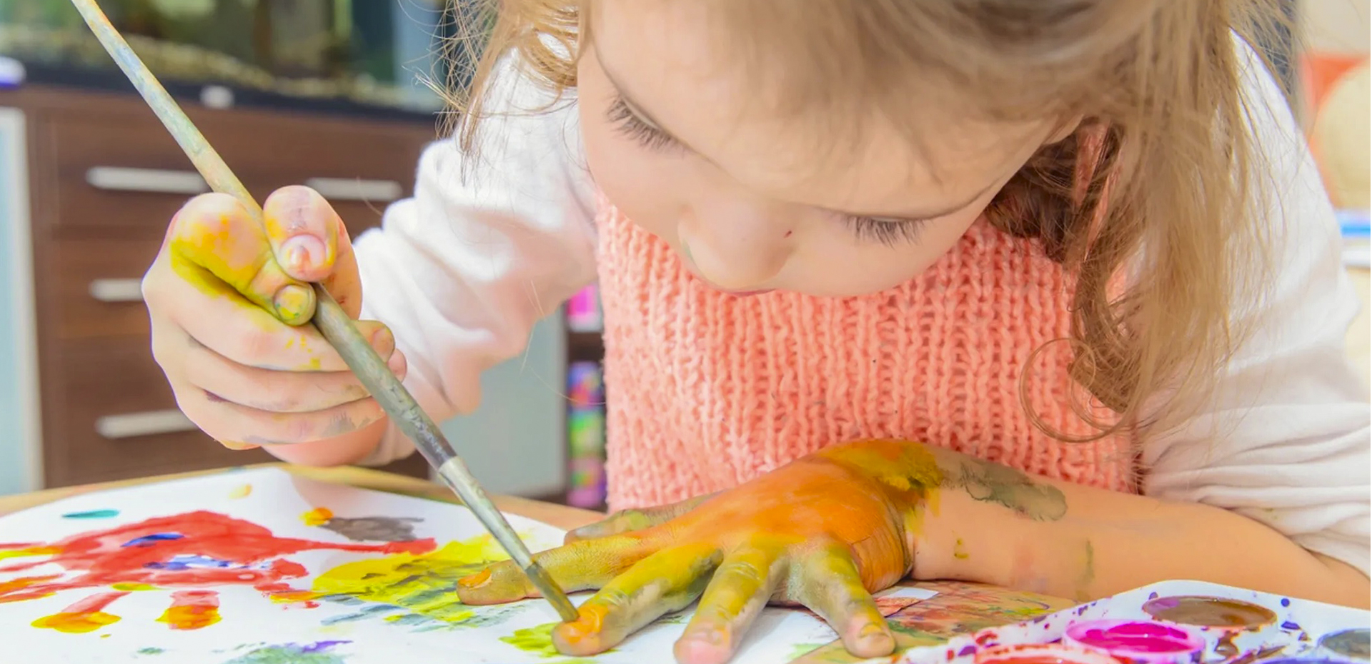 Little girl painting for therapy